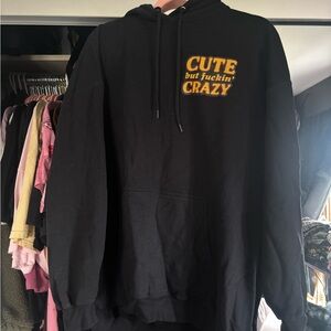 Black Crewneck Sweatshirt with Yellow 'Cute but fuckin' Crazy' Chest Graphic